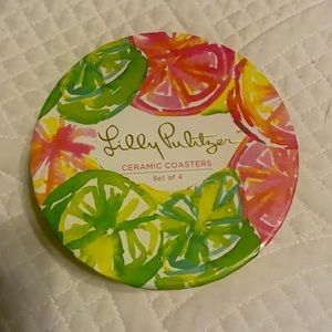 Lilly Pulitzer coasters.  NWT. Never used .  Beautiful gold trim. Great gift